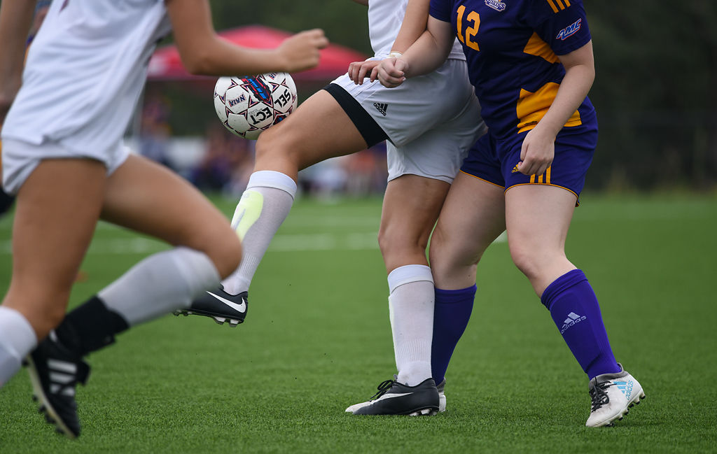 Ruth Zapico Mancebo dribbles the ball around Nicole Gasparovic